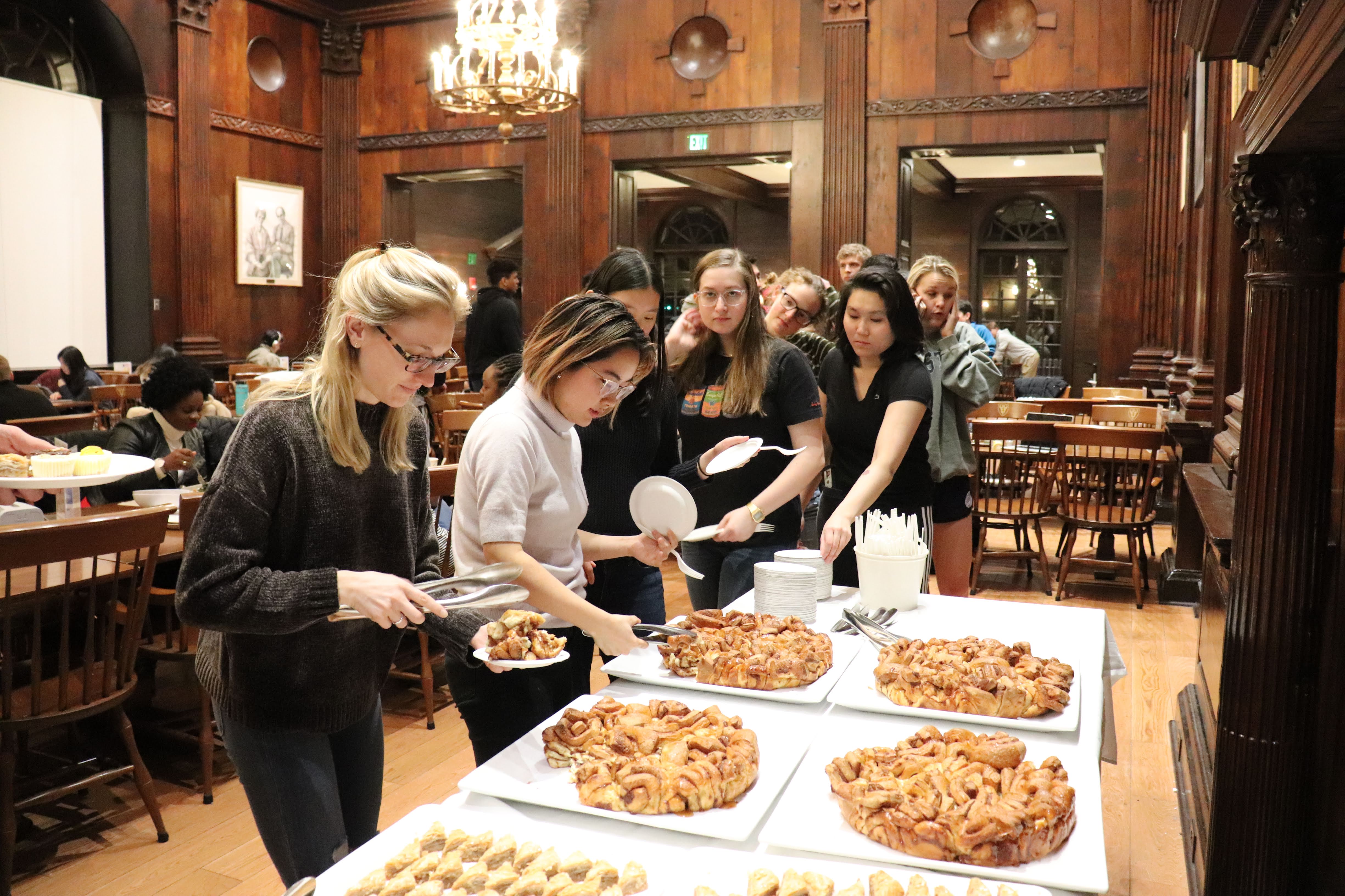 students in line for monkey bread in dining hall