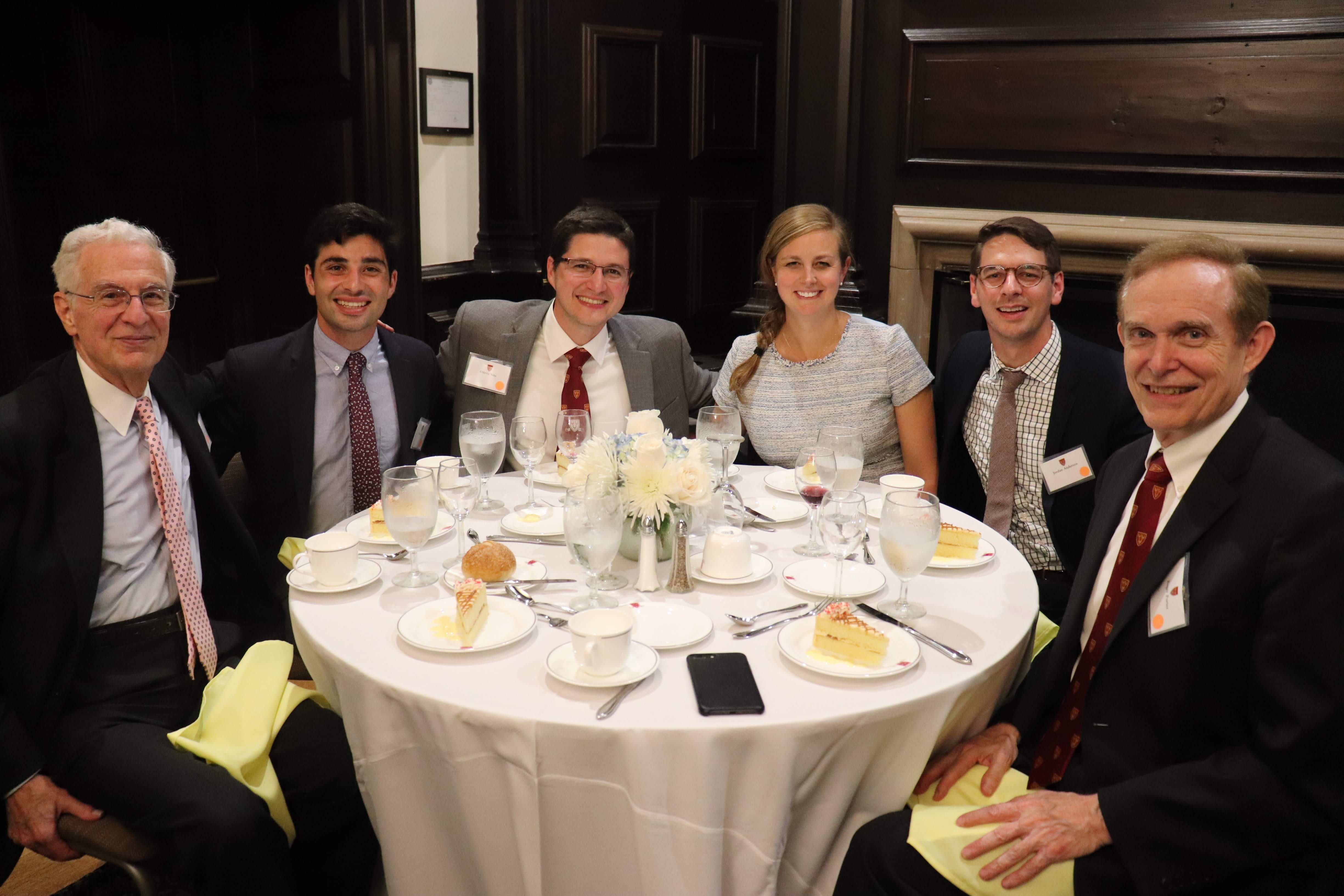 students and senior common room members sitting at a table