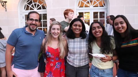 students and tutors smiling in Dunster courtyard