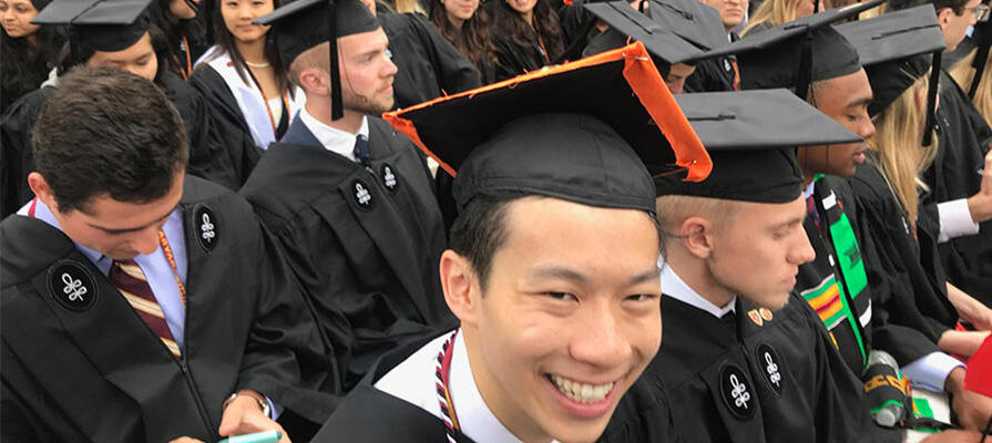 Students smiling at graduation